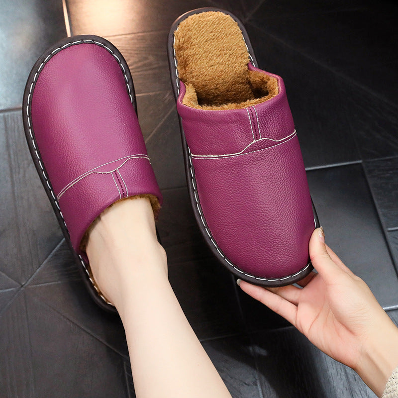EaseLane warm wide fit leather slippers – purple slipper worn with matching pair held