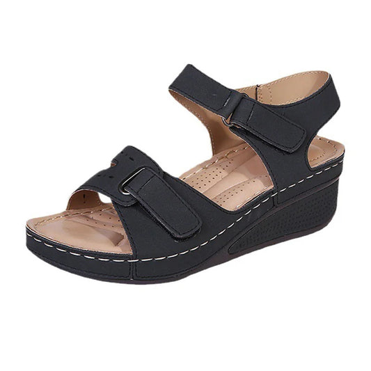 Black women's adjustable-strap wedge walking sandal with perforated footbed, product view