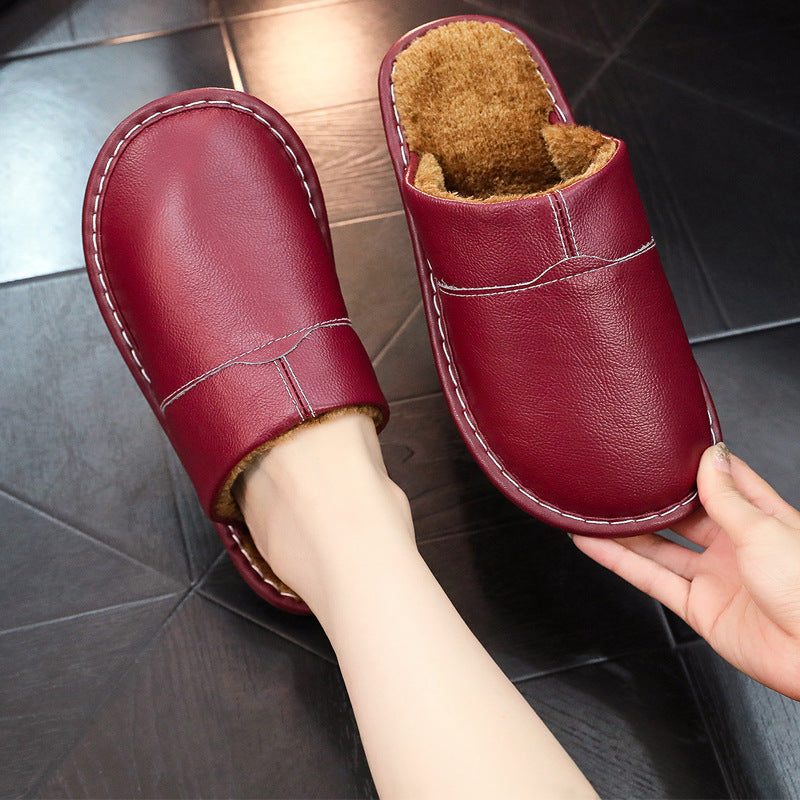 EaseLane warm wide fit leather slippers – burgundy slipper worn with matching pair held
