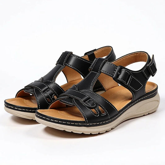 Pair of women's black adjustable strap walking sandals, front three-quarter view