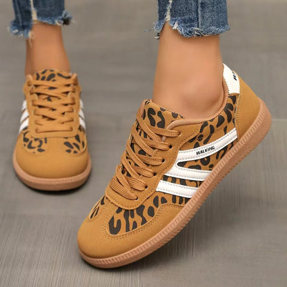 Women's tan leopard-print retro trainers worn from the front