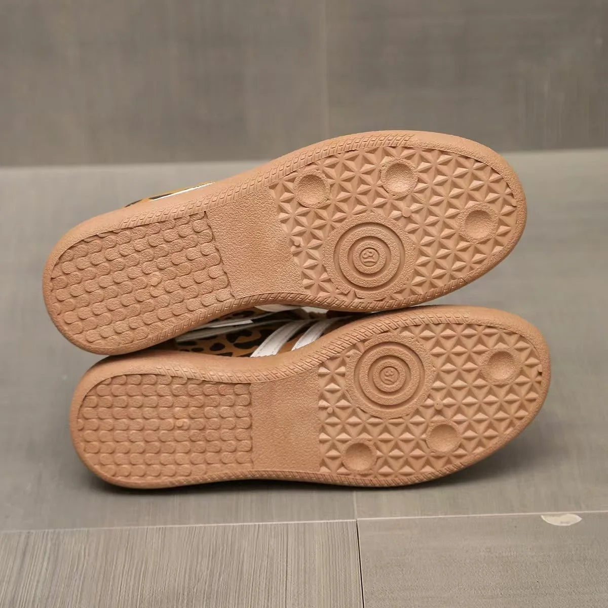 Textured gum-colour outsoles of women's retro trainers
