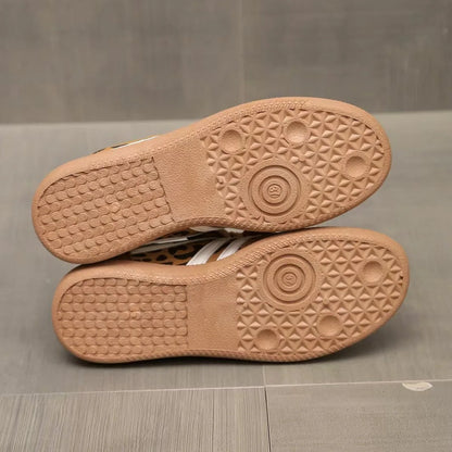 Textured gum-colour outsoles of women's retro trainers