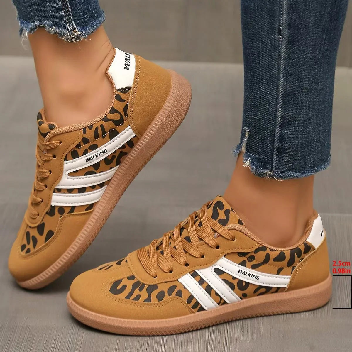 Women's tan leopard-print retro trainers worn from the side