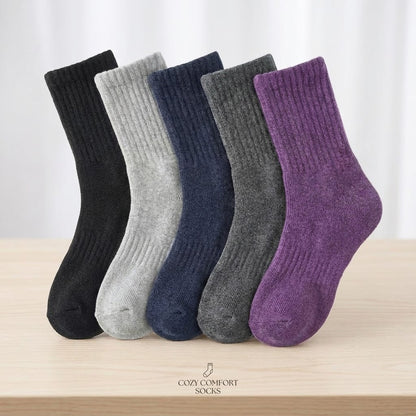Five-pair winter crew socks – five pairs arranged on a wooden surface