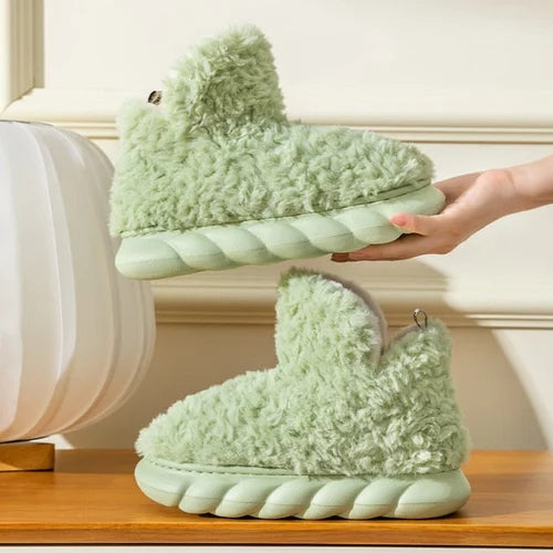 Plush fleece ankle slippers – green pair showing sole flexibility